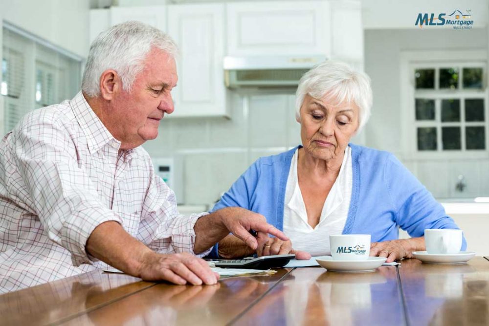 Couple reviewing pros and cons of a reverse mortgage